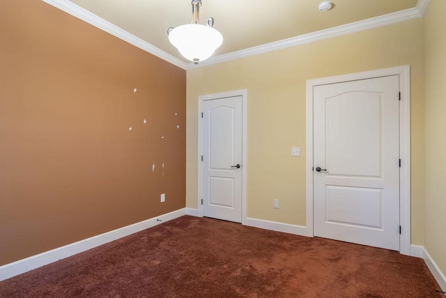 unfurnished bedroom featuring dark colored carpet and crown molding