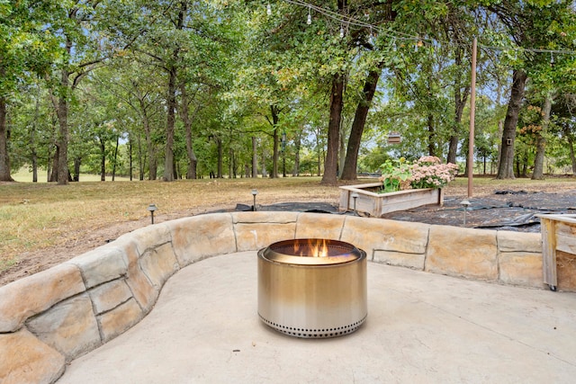 view of patio / terrace with a fire pit