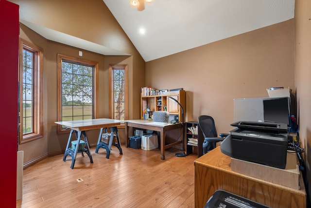 office space with light hardwood / wood-style flooring and high vaulted ceiling