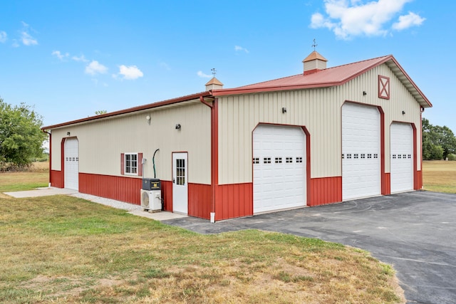 garage featuring a lawn