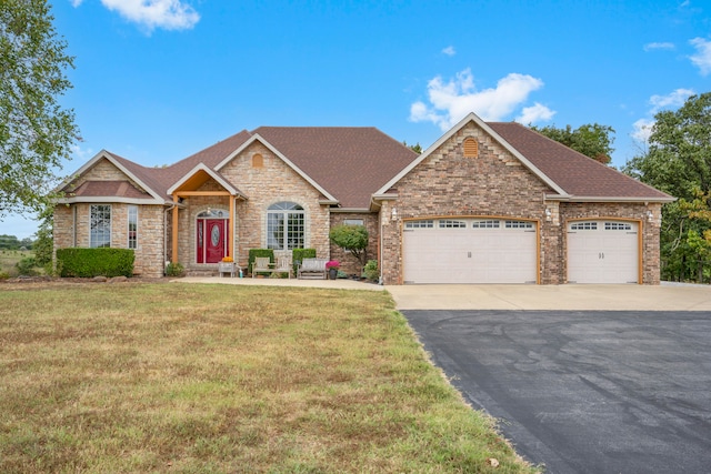 view of front facade with a front yard and a garage