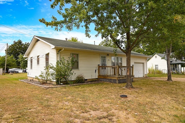 view of front of house with a garage and a front lawn