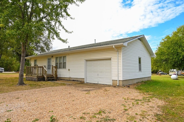 single story home featuring a garage and a front yard