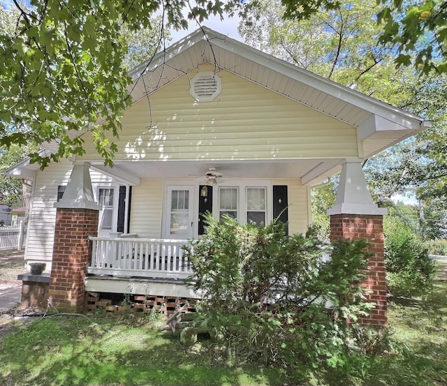 rear view of house featuring covered porch