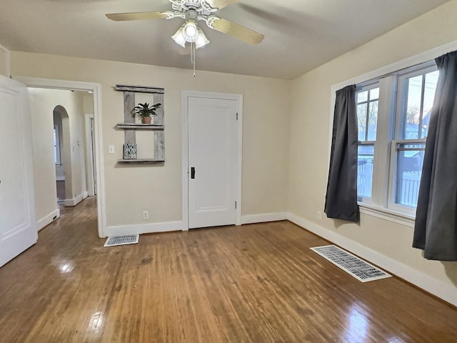 spare room featuring ceiling fan and hardwood / wood-style floors