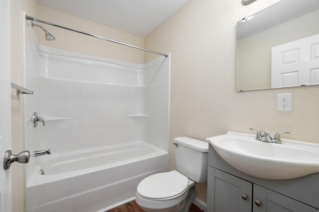 full bathroom featuring  shower combination, hardwood / wood-style flooring, vanity, and toilet