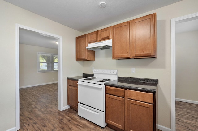 kitchen with a textured ceiling, white range with electric cooktop, and dark hardwood / wood-style flooring