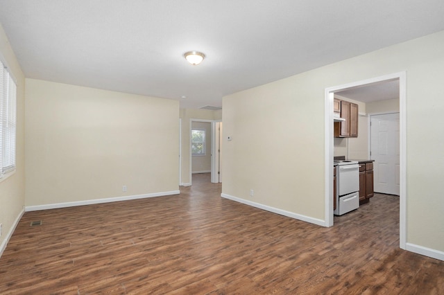 empty room featuring dark wood-type flooring