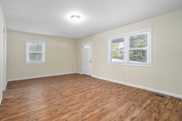 spare room with hardwood / wood-style flooring