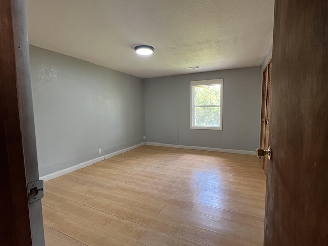 empty room featuring light hardwood / wood-style floors