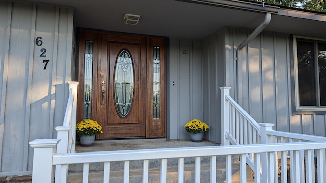 doorway to property with board and batten siding