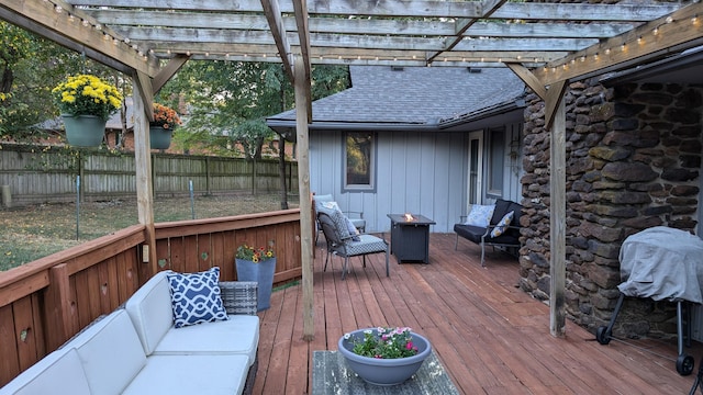 wooden terrace with a pergola and a fenced backyard