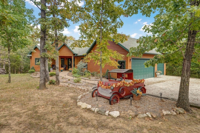 log-style house featuring a garage