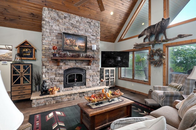 living room featuring ceiling fan, a stone fireplace, high vaulted ceiling, wooden ceiling, and hardwood / wood-style floors