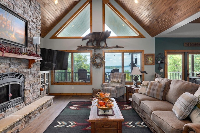 living room with hardwood / wood-style flooring, high vaulted ceiling, and wooden ceiling