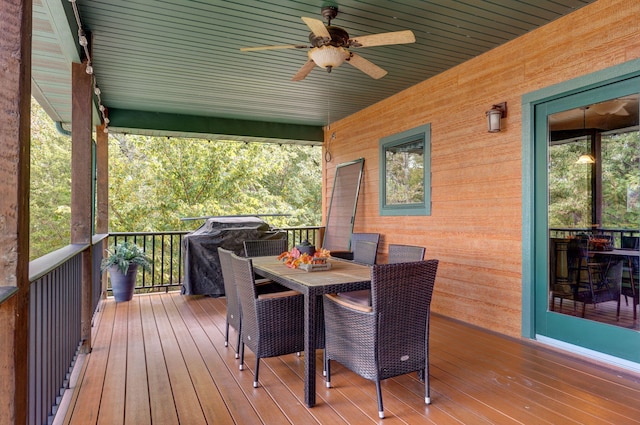 wooden terrace featuring ceiling fan