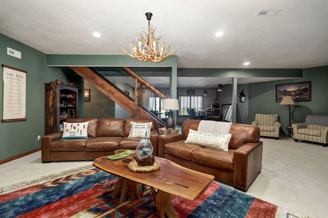 living room with light carpet, a textured ceiling, and an inviting chandelier