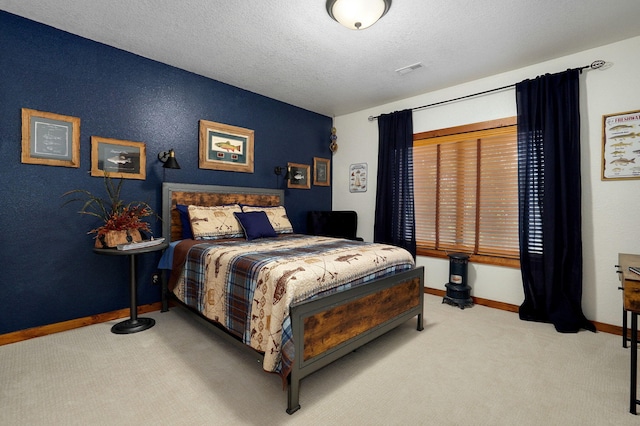 carpeted bedroom featuring a textured ceiling