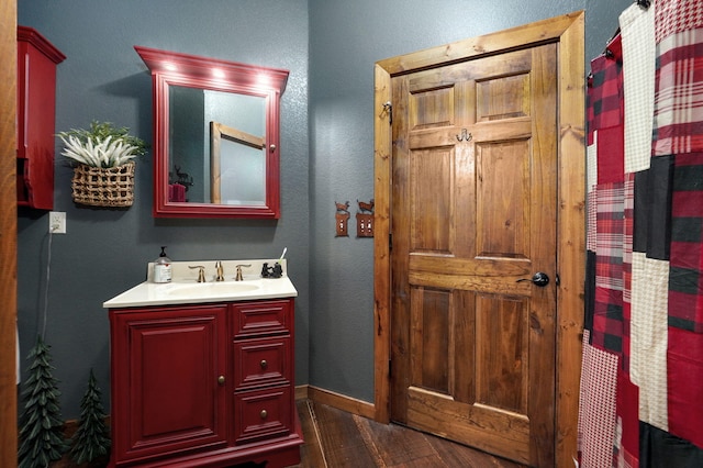 bathroom featuring hardwood / wood-style floors and vanity