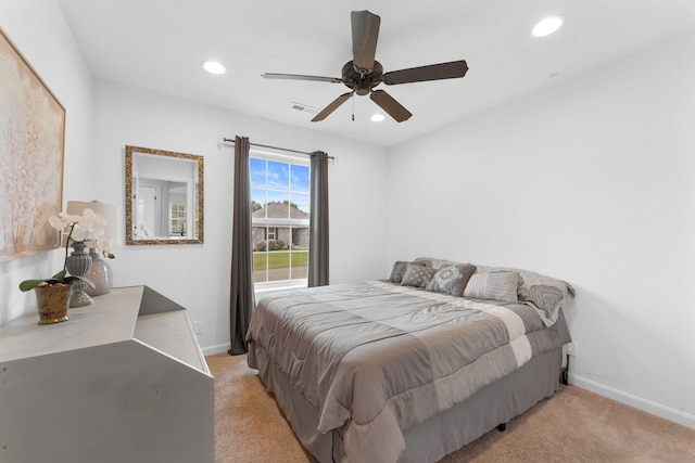 carpeted bedroom featuring ceiling fan