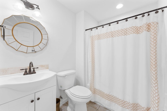 bathroom with vanity, tile patterned flooring, toilet, and a shower with shower curtain