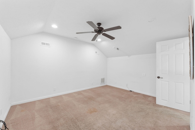 bonus room with light carpet, lofted ceiling, and ceiling fan