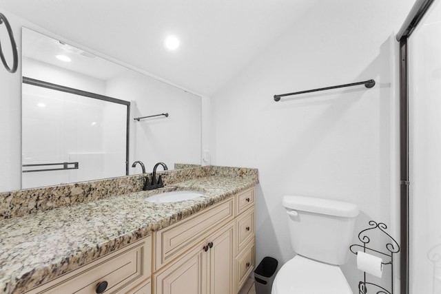 bathroom with walk in shower, vaulted ceiling, vanity, and toilet