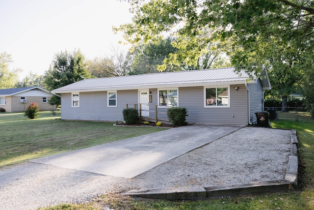 ranch-style house with a front lawn