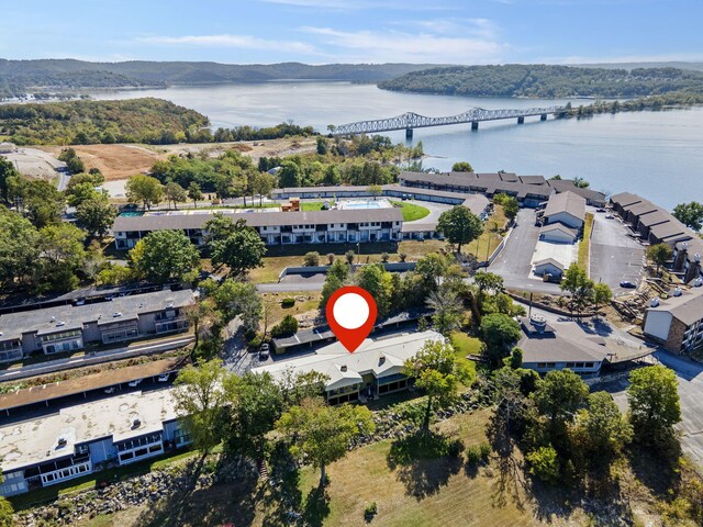 birds eye view of property featuring a water and mountain view