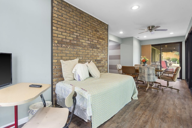 bedroom with hardwood / wood-style floors and ceiling fan