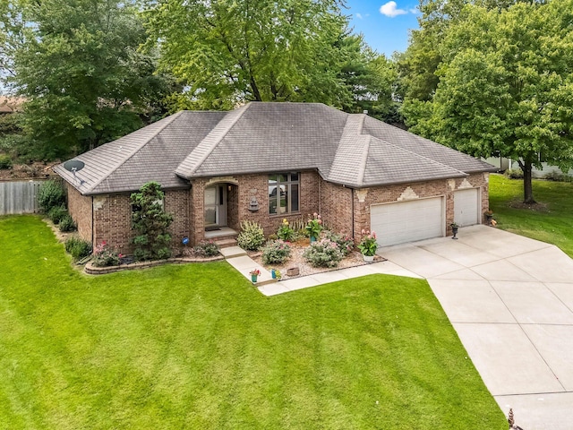 view of front of property featuring a garage and a front lawn