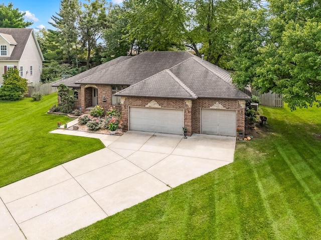 view of front of property with a garage and a front yard