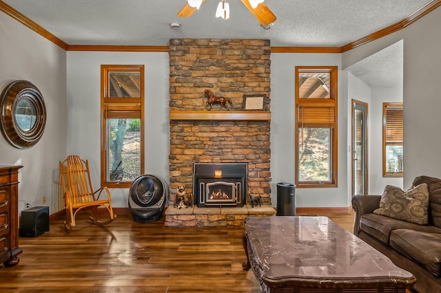 living room featuring hardwood / wood-style floors, a wealth of natural light, a textured ceiling, and ceiling fan