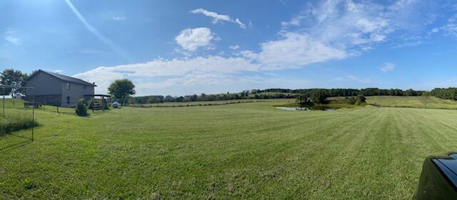 view of yard with a rural view