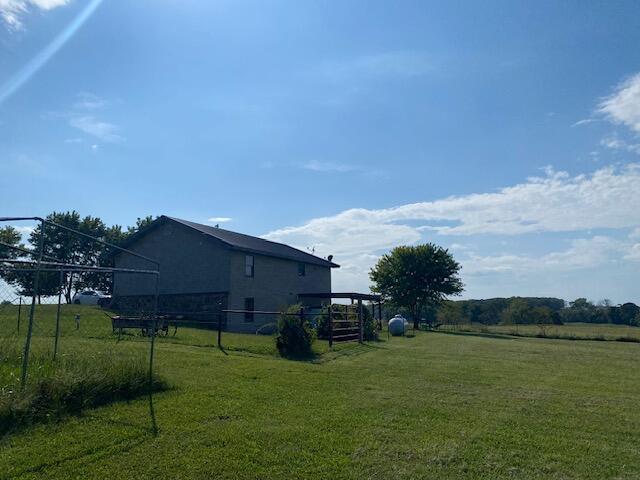 view of yard with a rural view