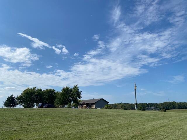 view of yard with a rural view