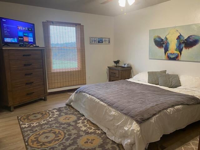 bedroom featuring ceiling fan and light wood-type flooring