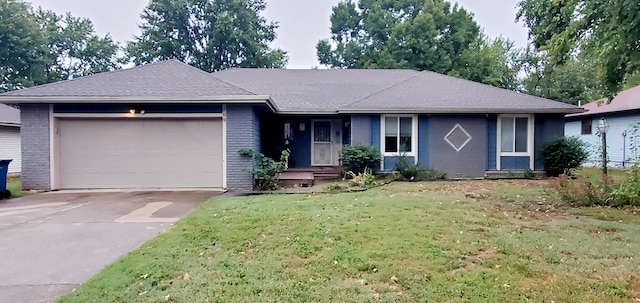 ranch-style home with a front yard and a garage