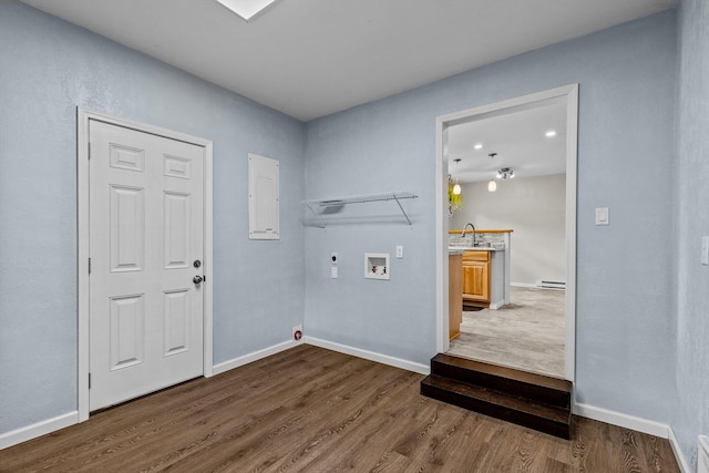 laundry room with washer hookup, gas dryer hookup, dark hardwood / wood-style flooring, sink, and electric dryer hookup