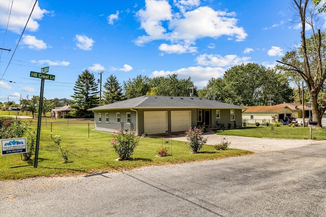 single story home with a front lawn and a garage