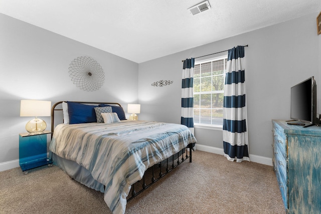 bedroom featuring light colored carpet