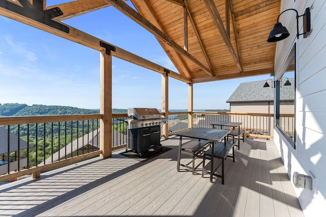 wooden deck with a grill