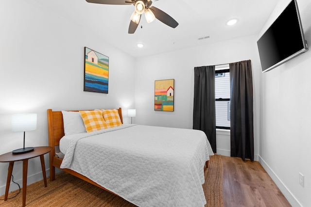 bedroom featuring ceiling fan and wood-type flooring