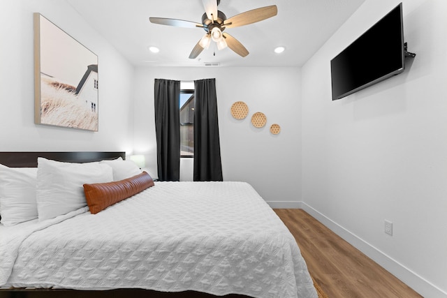 bedroom featuring wood-type flooring and ceiling fan