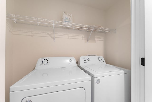 laundry room with separate washer and dryer