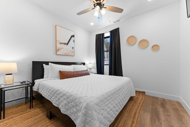 bedroom featuring ceiling fan and hardwood / wood-style floors