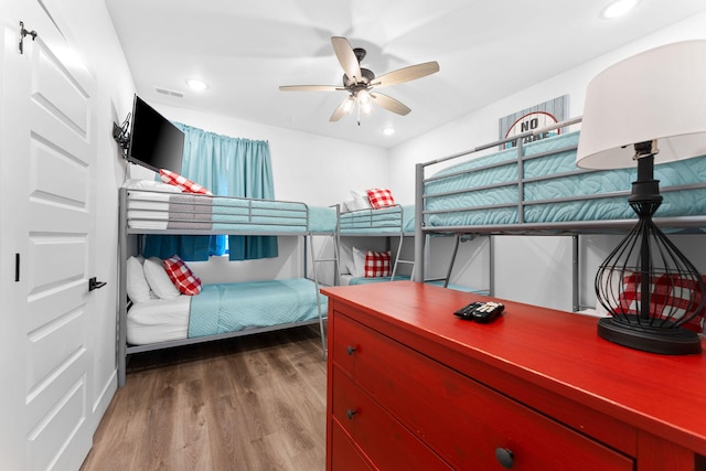 bedroom featuring ceiling fan and hardwood / wood-style floors