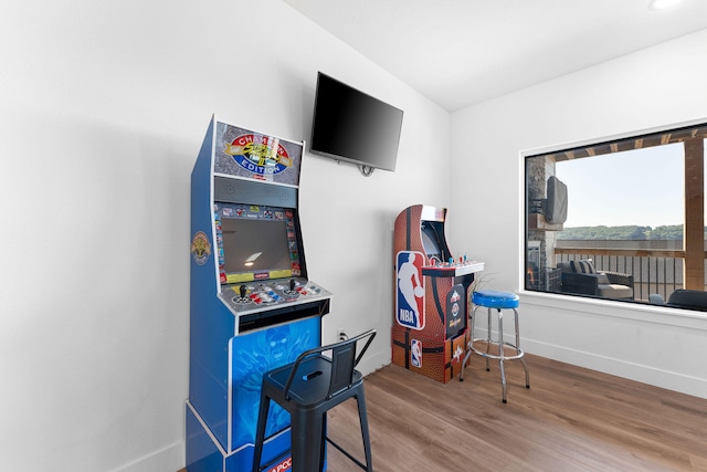 recreation room with hardwood / wood-style floors