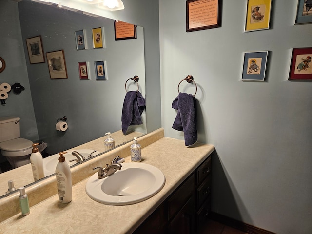 bathroom with vanity and toilet