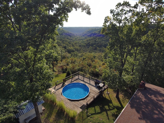 view of swimming pool with a deck